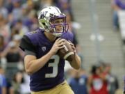 Washington quarterback Jake Browning drops to pass against Utah State in the first half of an NCAA college football game, Saturday, Sept. 19, 2015, in Seattle. (AP Photo/Ted S.