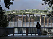 Jeff McBride of Vancouver spends a peaceful moment before work checking out scenic views of the Interstate Bridge and the Columbia River on Thursday morning, Sept. 3, 2015. McBride, who has lived in the area for 10 years, said he is looking forward to the development of the waterfront area.