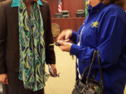 Battle Ground: Newly elected state Rep. Liz Pike, R-Camas, speaks with one of nearly 50 constituents who attended a legislative town hall meeting Jan. 5 at Battle Ground City Hall. Pike and state Sen.