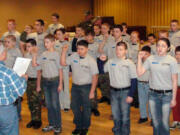 Riveridge: Lewis &amp; Clark Young Marines Recruit Platoon 33013 stand at attention Jan. 5 at the Vancouver Elks Lodge as Vancouver City Councilor Larry Smith leads them in the Young Marine Obligation oath.