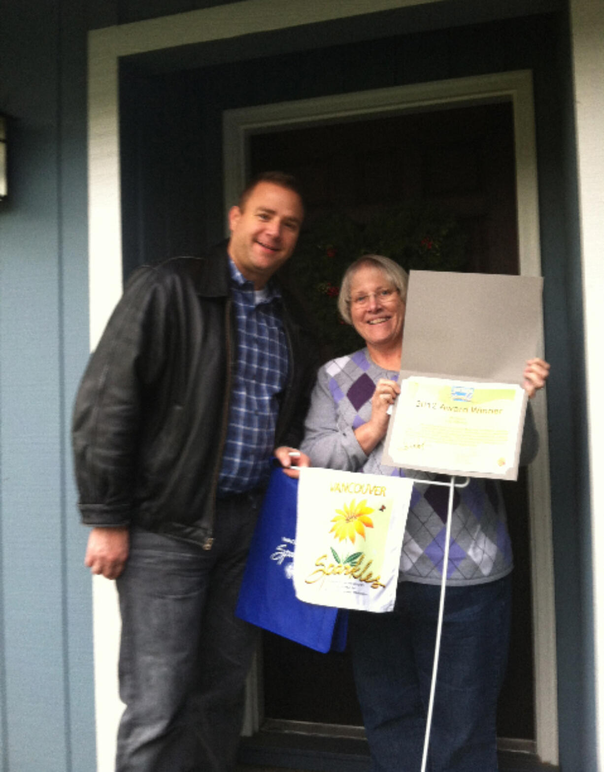 Wildwood: Volunteer Loy Pehrson, right, receives her Vancouver Sparkles award from neighborhood association chairman Shane Gardner.