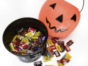 Kids may collect miniature candies while trick-or-treating, but local dietitians and pediatricians warn the calories in those smaller versions can quickly add up.