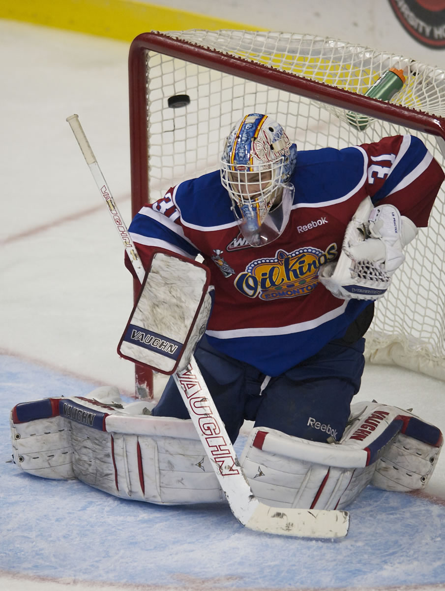 Edmonton goaltender Laurent Brossoit is beat by the puck shot by Winterhawks' Brendan Leipsic that tied the game at 2-2.