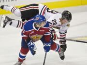 Portland's Brendan Leipsic takes a tumble over Edmonton defenseman Dysin Mayo in the first period at the Rose Garden on Friday.