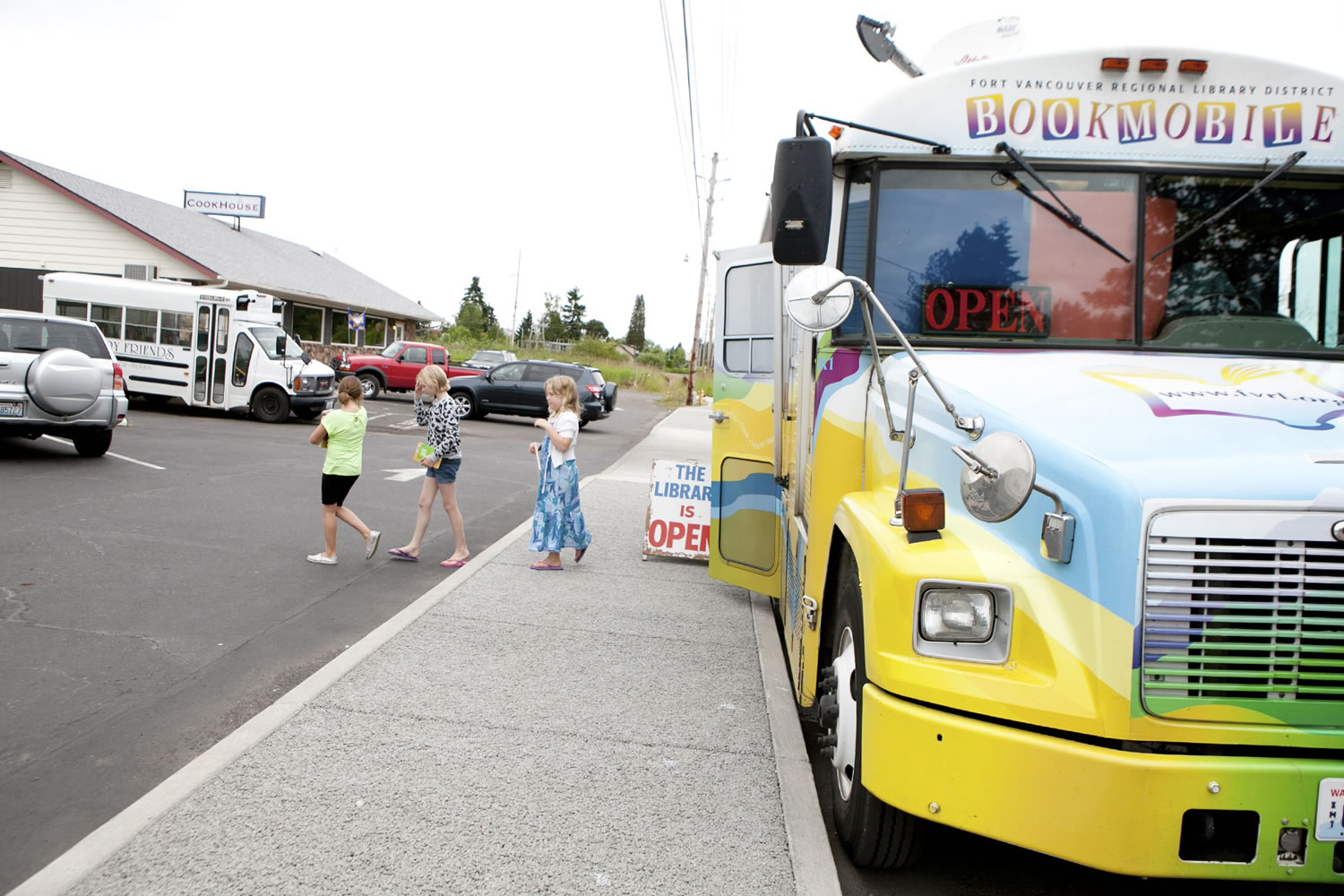 Students from Country Friends Daycare exit the bus after looking at books on the bookmobile, which made its final stop Friday morning in Hockinson.