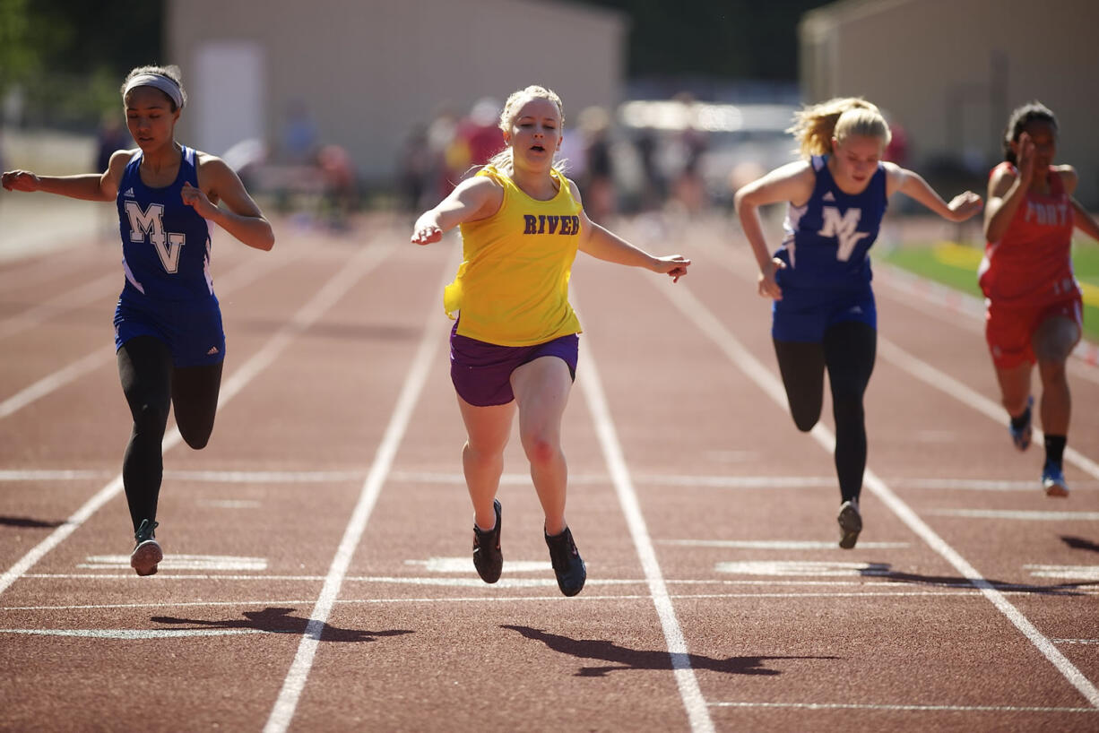 Emily Morgan of Columbia River High School wins the girls 100 meter dash with a time of 12.37 at the 3A District Track and Field meet Wednesday May 8, 2013 in Vancouver, Washington at McKenzie Stadium.