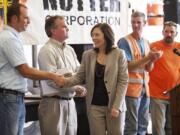 U.S. Sen. Maria Cantwell shakes hands with Navy veteran Ed Hagedorn during a visit to Nutter Corp.