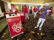 Dean Zack, 22, of Vancouver fills out an application at a Target job fair held at the Red Lion Hotel Vancouver at the Quay on Thursday.