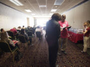 Applicants wait to be interviewed at a Target job fair  at the Red Lion Hotel Vancouver at the Quay on Aug.