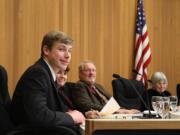 Caleb Bischoff, the student representative on the Washougal City Council, smiles at an audience member on Monday night.