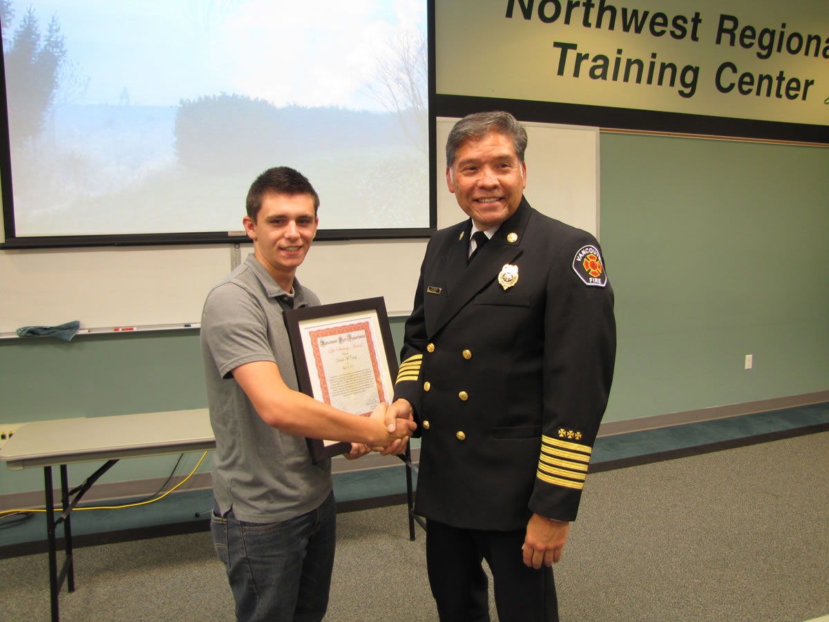 Derek McCarty, left, saved stranger's life on roadside.