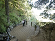 Laina Harris, right, and her friend Rondie White take photos at the top of the Multnomah Falls trail Aug. 25.