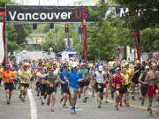 Runners start the 2013 Vancouver USA Marathon on Sunday in downtown Vancouver.