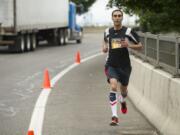 Youssef Zizari of Vancouver leads the 2013 Vancouver USA Marathon at mile 14.