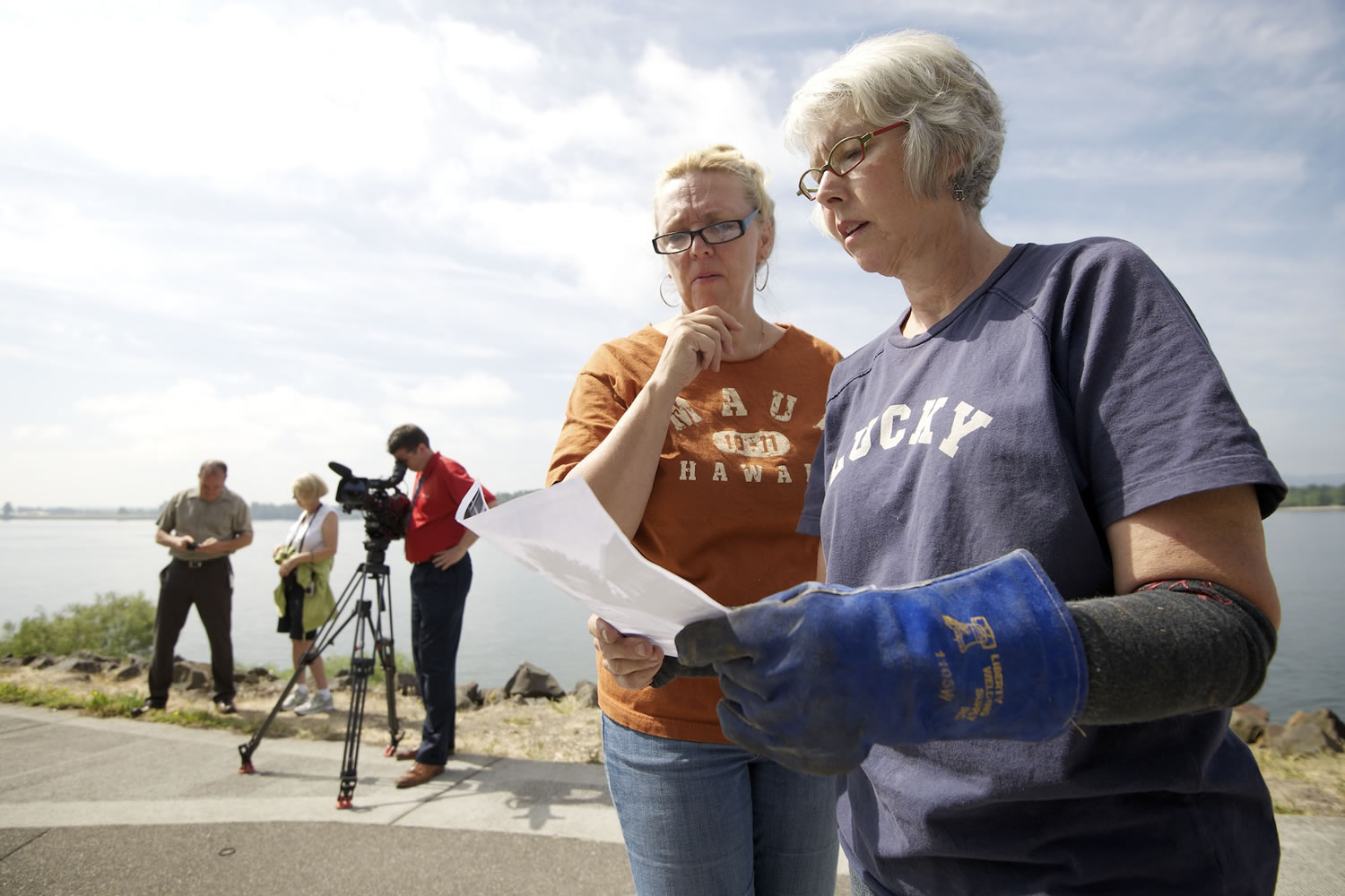 Artist Sharon Warman Agnor, right, looks over a photograph of the original &quot;Wendy Rose&quot; statue as a guide to head placement with help from artist Kathy Willson, left.