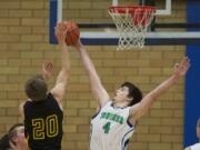 Mountain View's Shane McCauley, #4, blocks the shot of  Hudson's Bay's Jacob Buslach, Friday, January 4, 2013.