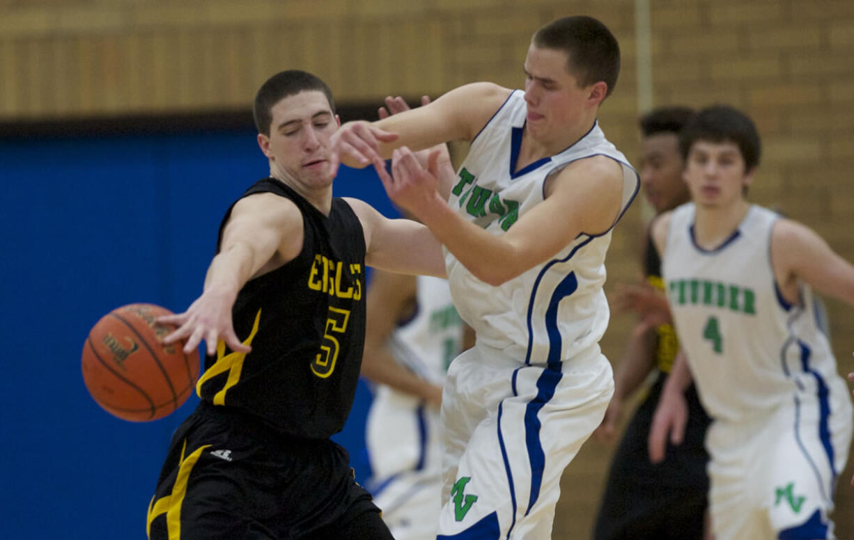 Hudson's Bay's Micah Fitzpatrick, #5, steals the ball from Mountain View's Luke DuChesne, Friday, January 4, 2013.