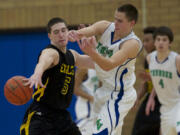 Hudson's Bay's Micah Fitzpatrick, #5, steals the ball from Mountain View's Luke DuChesne, Friday, January 4, 2013.