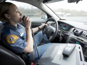 Washington State Patrol Trooper Alexis Tonissen radios dispatch about an aggressive speeder on Interstate 5.