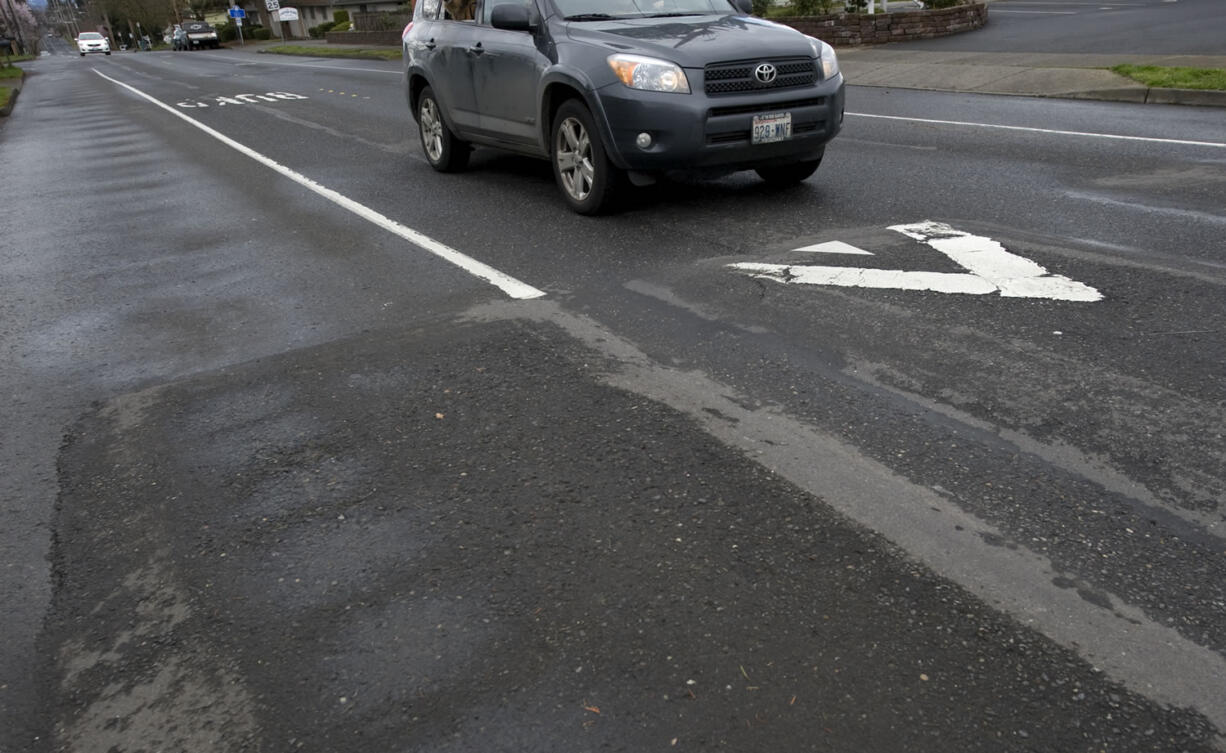 A car approaches a speed bump heading northbound on Kauffman Avenue in 2009.