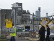 ILWU workers walk the picket line on day three of a lockout by United Grain Corp.