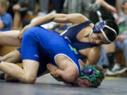 Skyview's Jose Nava-Montez, top, takes down Mountain View's Branden Huft in the 106-pound semifinal at the Pacific Coast Wrestling Championships at Hudson's Bay High School on Saturday.