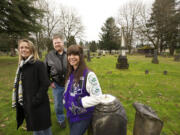 Zoe Hall, 17, a junior at Heritage High School, stands with her parents, John and Dani Hall, in Vancouver's Old City Cemetery in the Central Park Neighborhood.