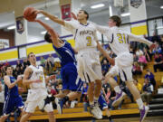 Columbia River's Devin Bolds (3) blocks the shot of Mountain View's Luke DuChesne as River repeated as district champion.