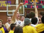 Columbia River celebrates after beating Mountain View at the 3A district basketball finals at Columbia River High School, Friday, February 8, 2013.