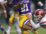 Columbian River's Jayson Branson fights his way across the goal-line to tie the game 7-7 against Kennedy Catholic in a 3A playoff match-up in the first half at Kiggins Bowl on Saturday November 10, 2012. River lost the game 14-20.