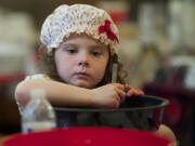 Lily Ritton, 5, of Venersborg helps make strawberry freezer jam during Homestead Day at the Venersborg Schoolhouse on Sunday.