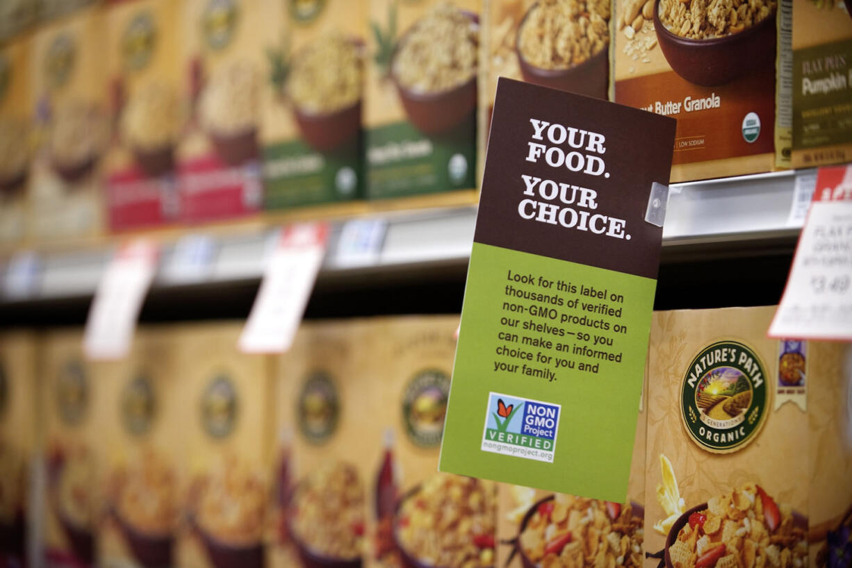 A sign advises customers at New Seasons Market in Vancouver.