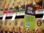 A sign advises customers at New Seasons Market in Vancouver.