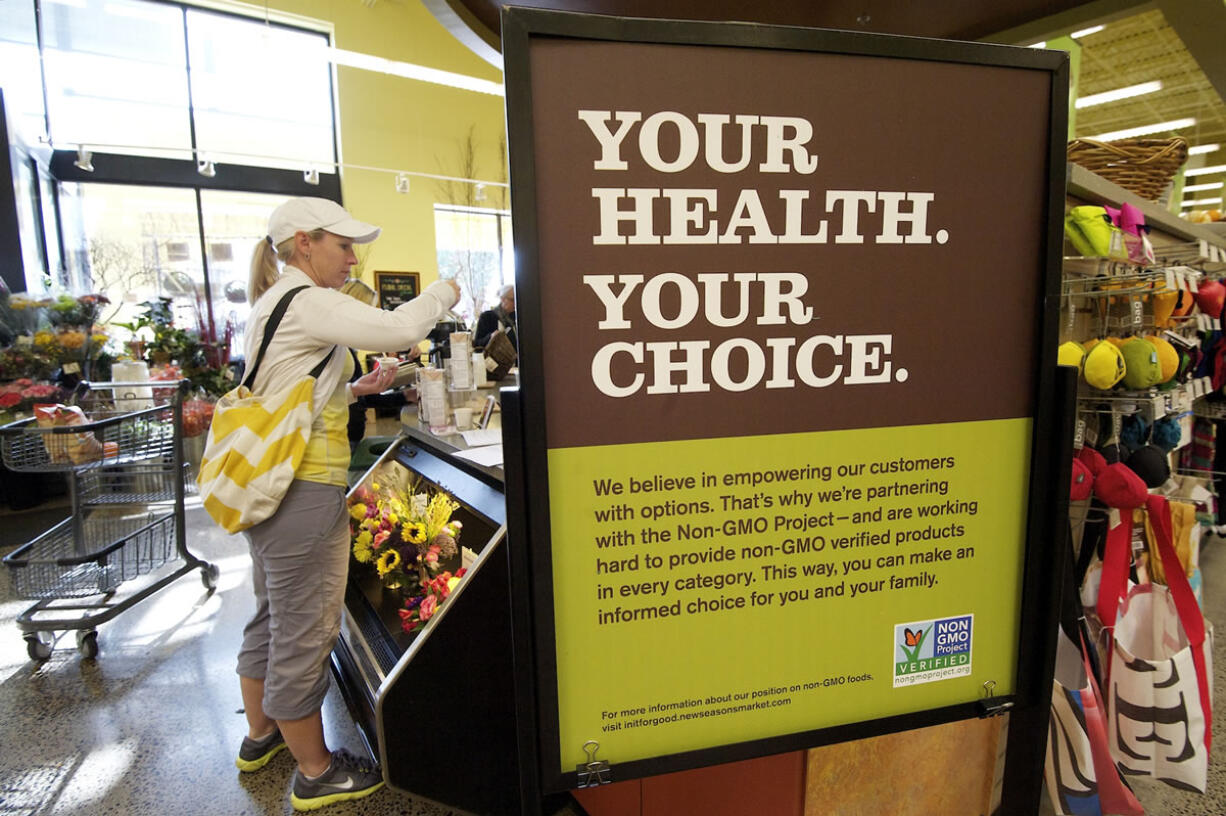 A sign advises customers at New Seasons about GMO products in Vancouver, Washington.