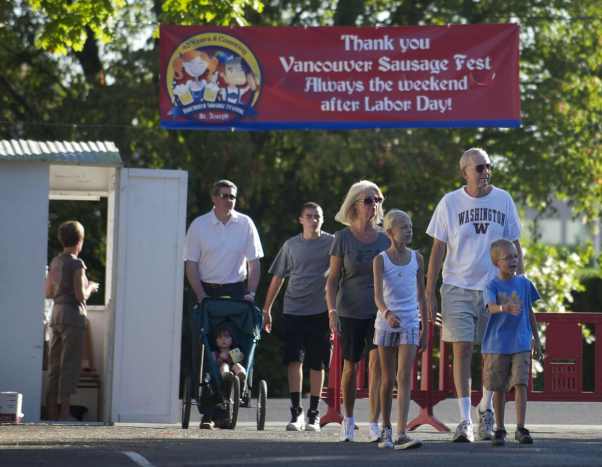 People arrive at the start of the Sausage Fest, an annual fundraiser for St.