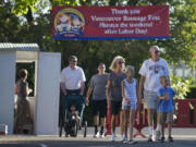 People arrive at the start of the Sausage Fest, an annual fundraiser for St.