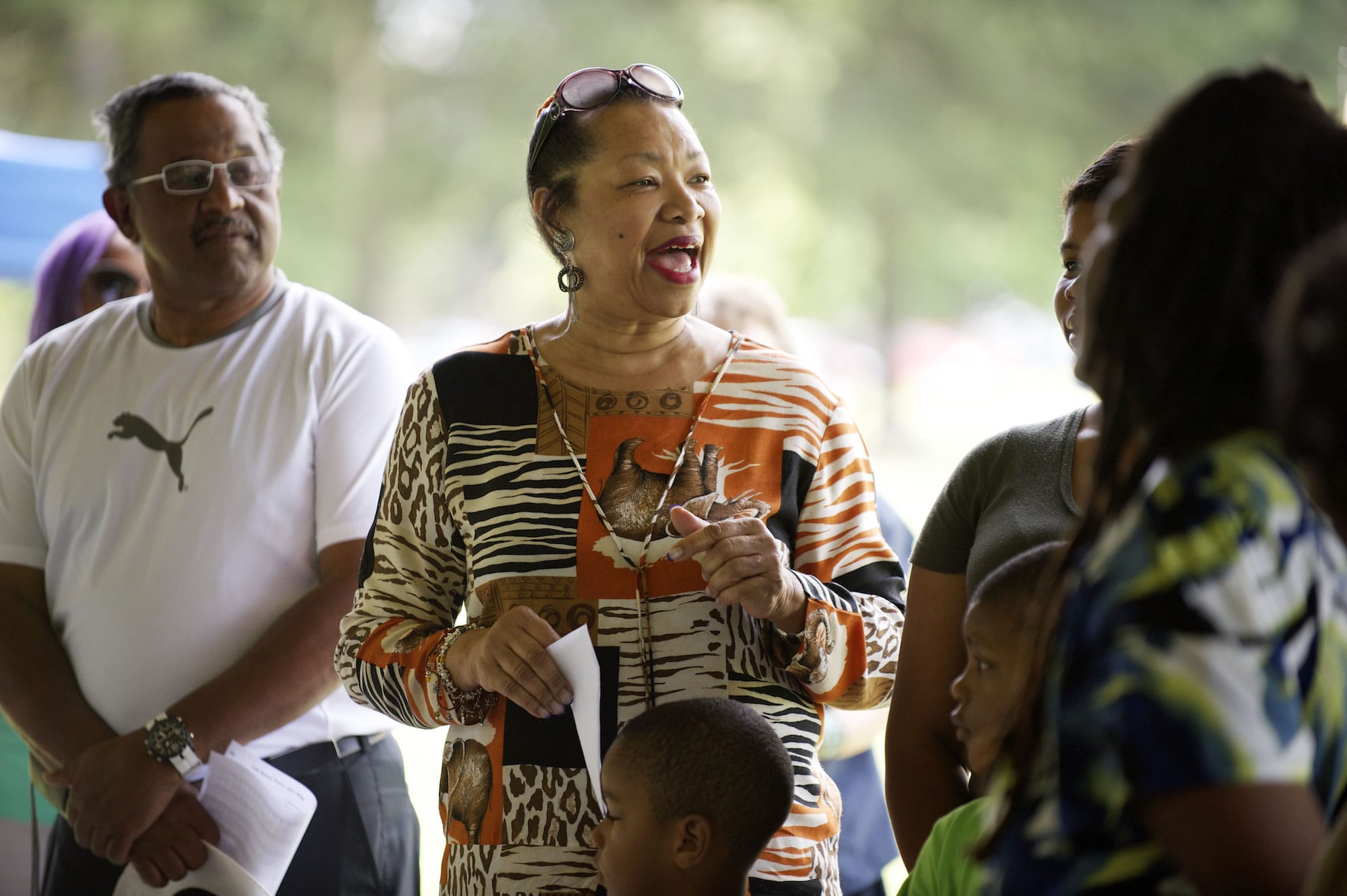 Ethell Tillis, center, emcees the Juneteenth celebration Saturday at Marine Park in Vancouver.