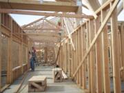 Workers recently positioned trusses on The Hampton at Salmon Creek, a 43-unit care center for seniors with memory issues.