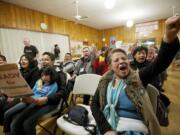 Lupe Sanchez of Yakima, right, shouts for immigration reform at a rally Tuesday at St. Luke's Episcopal Church in Vancouver. The rally began a statewide bus tour advocating for comprehensive immigration reform.