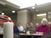 Jon Spratlen lights an &quot;AIDS Candle&quot; during a World AIDS Day event hosted by Martha's Pantry at the Clark County Health Department.