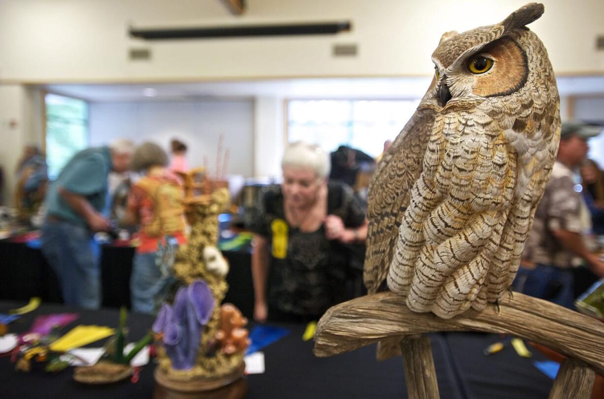 A great horned owl carved by Darrell Wilson, of Calgary, Alberta, proved to be a crowd favorite Sunday by taking home the People's Choice award at the Columbia Flyway Wildlife Show at the Water Resources Education Center in Vancouver.