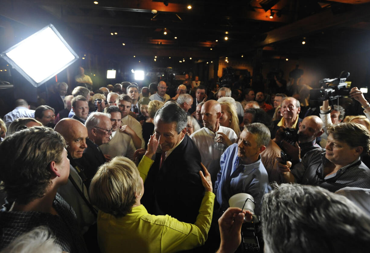 Former South Carolina Gov. Mark Sanford, center, is surrounded by supporters after giving his victory speech after winning back his old congressional seat in the state's 1st District on Tuesday in Mt.