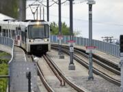 A light rail train makes its way to the Delta Park/Vanport transit station.