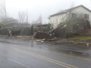 A tornado uprooted trees and destroyed portions of a fence Thursday, Dec.