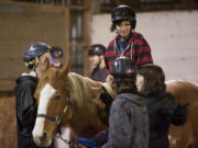 Photos by Steven Lane/The Columbian
Josh Farmer, 12, rides Cowboy for the first time at Silver Buckle Ranch. The ranch's core program is intended to build confidence through interactions with horses.