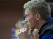 Mountain View senior Jake Ryan watches the action from the bench Tuesday night, Dec. 15, 2015 at Heritage High School.