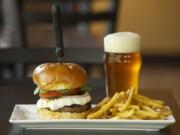 The Mill City lamb burger with fries and beer are among the offerings at Mill City Brew Werks in Camas.