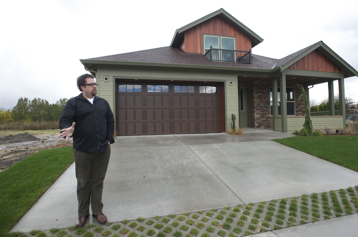 Urban NW Homes founder and owner Troy Johns stands outside a Salmon Creek-area house that aims to be the area's first &quot;net zero&quot; home.