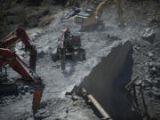 At the peak of Condit Dam demolition in July, shown here, crews were removing about 500 cubic yards of concrete per day. The dam was breached in October.