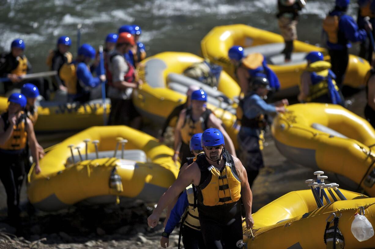 Rafters use a rebuilt take-out ramp from the White Salmon River on Wednesday at Northwestern Lake Park, a few miles upstream of Condit Dam.